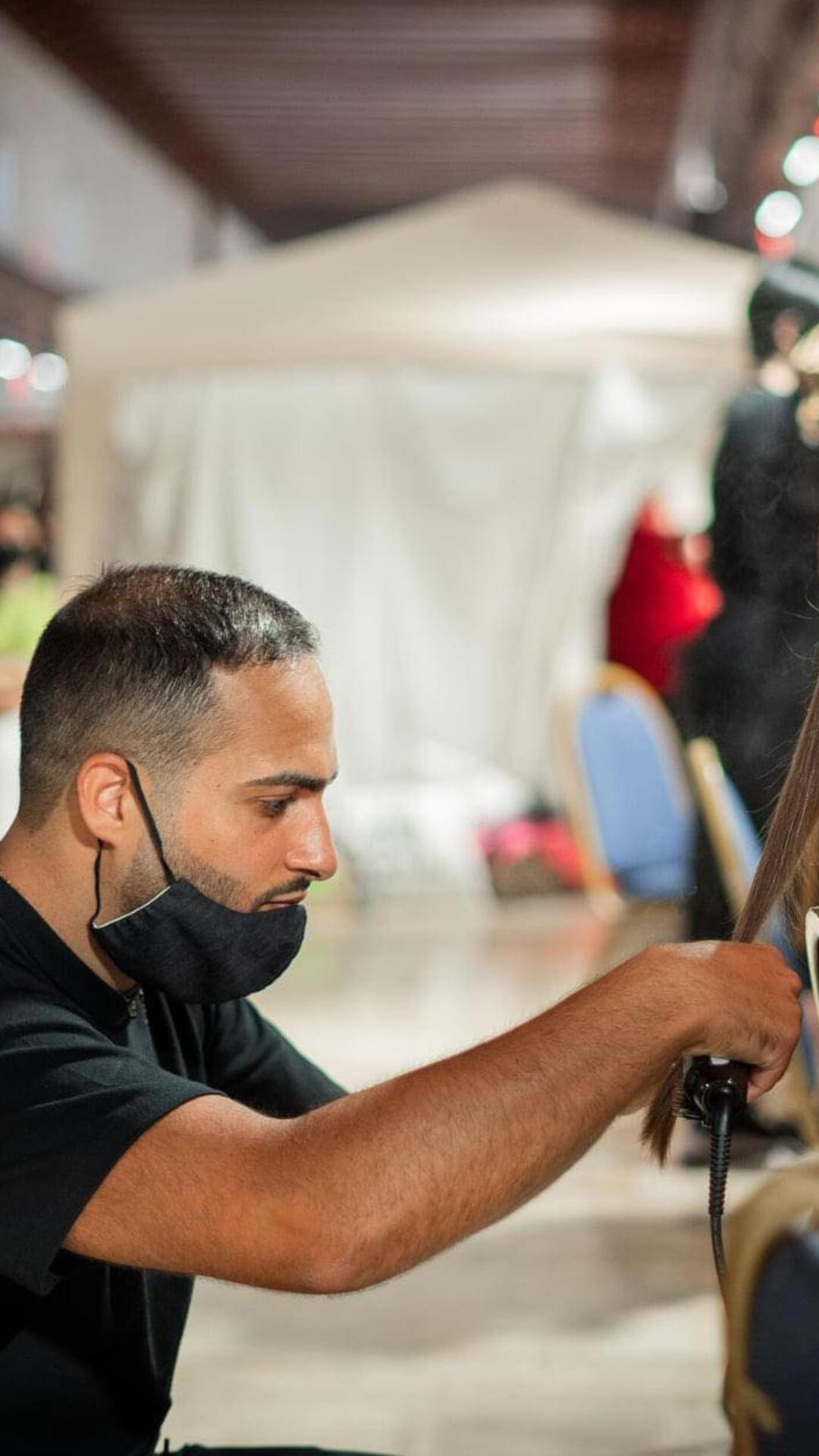 Francesco Varamo, renowned Italian hairstylist & artistic director, Malta, cutting hair on a model